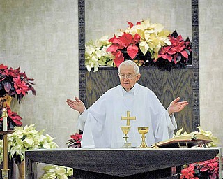 Father Edward Naroda leads the 9 a.m. mass in Polish at St. Stanislaus Kostka Catholic Church for the last time on Sunday. Beginning next weekend, the only Sunday mass will be at 10:30 a.m. and will be said in English.