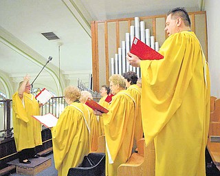 Members of the choir at St. Stanislaus Kostka Catholic Church sang Sunday during the church’s last Polish mass. Father Ed Naroda, who has been with the church for 30 years, said he will only hold one mass in English each Sunday, at 10:30 a.m., due to his health.