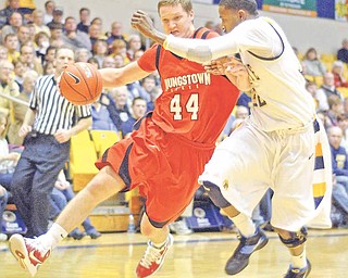 YSU's Vytas Sulskis rushes by KSU Rodriquez Sherman during the first period on Tuesday night at the Kent State MAC center in Kent, Ohio.