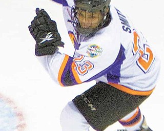 Youngstown Phantom, Quinn Smith, raises his stick in celebration after scoring his team's first goal past Team USA's Matt McNeely during the second period of a game at the Covelli Centre on Saturday afternoon.