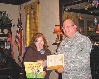 Promoting the draft: Members of the Rotary Club of Austintown had an opportunity to learn more about ESGR (Employer Support of The Guard and Reserve) program when Steve Prestridge, U.S. Army Chief Warrant Officer 3, spoke at a recent meeting. He explained the mission of the program is to develop and promote a culture in which all American employers support and value the military service of their employees and encouraged employers to “draft” qualified servicemen for any available jobs. Susan Leetch, club president, presented Prestridge with a certificate for a book to be donated to Woodside School in his honor.