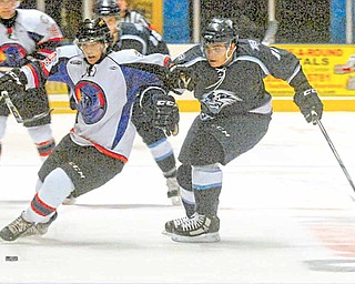 Mike Ambrosia of the Phantoms races Jarrod Rabey of the Indiana Ice to the puck.