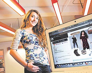 Carla Larin, pictured December 15, 2010, is an intern from Bergen Academy working at PlumWillow, a fashion themed social shopping community on the Internet. 