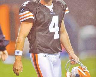 Cleveland Browns kicker Phil Dawson leaves the field after a preseason NFL football game against the  the St. Louis Rams Saturday, Aug. 21, 2010, in Cleveland.