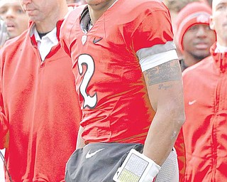 Ohio State  quarterback Terrelle Pryor (2) watches from the sidelines during second quarter action in their NCAA college football game against Michigan on Saturday, Nov. 27, 2010, in Columbus, Ohio. 