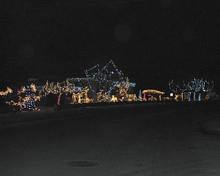 John and Dee Deem, whose holiday decorations span two lots, say people who drive by their Struthers home often stop and compliment their display.