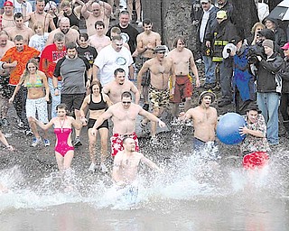 About 150 people plunged into the Shenango River in Sharon, Pa. for the third annual Polar Bear Jump on Saturday.