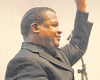 Luke Shumpert, minister of music at Elizabeth Baptist Church and director of the Emancipation Community Choir, directs the music Saturday morning during the Emancipation Proclamation and Installation Service at New Bethel Baptist Church.