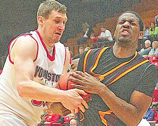 YSU's Dan Boulder fights with (23) Geoff McCammon for the ball during their game Saturday afternoon.