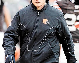 Cleveland Browns coach Eric Mangini walks to the locker room after the first half of an NFL football game against the Pittsburgh Steelers on Sunday, Jan. 2, 2011, in Cleveland. (AP Photo/Tony Dejak)