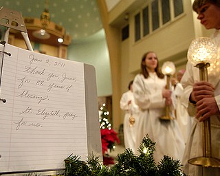Altar girls and boys take part in the final mass at St. Elizabeth’s. No decision has been made as to how the building will be used after this final mass.