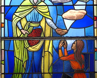 A stained-glass window at St. Elizabeth’s Church in Campbell. The church held its final mass at 9 a.m. Sunday.