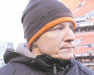 Cleveland Browns head coach Eric Mangini leaves the field after his team was defeated 41-9 in their NFL football game on Sunday, Jan. 2, 2011, in Cleveland. It was announced by the team Monday morning that Mangini was relieved of his duties as head coach of the Cleveland Browns.