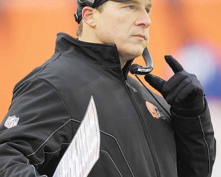 Cleveland Browns head coach Eric Mangini stands on the sidelines in the second half of an NFL football game against the Cincinnati Bengals, Sunday, Dec. 19, 2010, in Cincinnati. Cincinnati won 19-17.