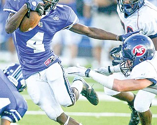 Poland's Darius Patton eludes Fitch defenders during first quarter action at Poland.