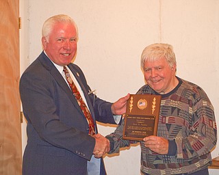 Trumbull County Tourism Bureau elected three new trustees during its semiannual meeting at Cortland Wine Cellar. During the event, outgoing trustee Jerry Usselman, left, also presented the organization’s first Presidential Award to David H. Hamilton, who was recognized for his years of service to the community.