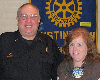 The truth about D.A.R.E.
An informative program on Drug Awareness Resistance Education was presented by Austintown Police Sgt. Jeff Toth at the Jan. 3 meeting of The Rotary Club of Austintown. A member of the police force for 24 years, Toth has spent the past 11 years as a full time D.A.R.E. officer. His focus is to alert youngsters to the dangers of using drugs. He reported that heroin is a major problem because users are hooked for life. He noted that prescription drugs, alcohol and marijuana are all concerns and that the Internet is exposing youngsters to other risky issues. Toth handles Crime Watch neighborhood units and his tip line at 330-270-5108 offers a place to leave an anonymous tip on crimes. He summed up his talk by stressing the need for vigilance in all neighborhoods. He was commended by Austintown Schools Superintendent Vince Colaluca for the Safety Town program he runs in the summer for kindergarten-age children. Sharing a moment with Toth is Susan Leetch, Rotary Club president.