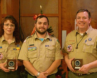In recognition of their noteworthy service to area youth through Scouting and service to the community, Jill Blance, at left, and Cliff Hovis, at right, were the recipients of the District Award of Merit for 2010, the highest award a district Scout leader can receive. They were joined by Chief Kiondashawa District Executive Brad Parola after accepting their awards.