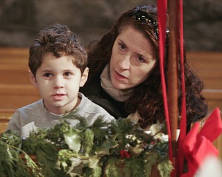 Walter Angell, 5, and his mother, Kate Angell of Pittsburgh, formerly of Youngstown, were part of a capacity crowd at Sunday’s 50th anniversary observance of the Boar’s Head and Yule Log Festival at St. John’s Episcopal Church, a 110-year-old Norman Gothic edifice in Youngstown.