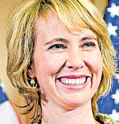 In this photo taken Wednesday, Jan. 5, 2011, Rep. Gabrielle Giffords, D-Ariz., takes part in a reenactment of her swearing-in, on Capitol Hill in Washington. Rep. Gabrielle Giffords of Arizona was shot in the head Saturday, Jan. 8, 2011 when an assailant opened fire outside a grocery store during a meeting with constituents, killing at least five people and wounding several others in a rampage that rattled the nation.
