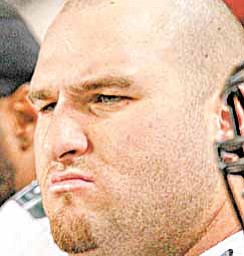 Philadelphia Eagles center Mike McGlynn on the bench in the second half of an NFL football game against the Chicago Bears in Chicago, Sunday, Nov. 28, 2010.