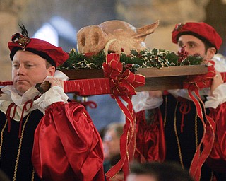 The boar’s head, symbolizing the triumph of Christ over evil, is carried into St. John’s Episcopal Church, 323 Wick Ave., Sunday to mark the 50th anniversary of the Youngstown church’s Boar’s Head and Yule Log Festival, which is held annually on the second Sunday in January.