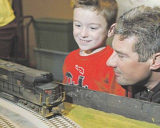 Michael Katula and his son Michael 4, check out model trains during model railroad flea market Sunday at McMenemys in Niles. They are from Struthers.