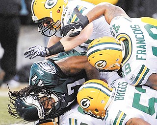 Philadelphia Eagles cornerback Gerard Lawson is stopped by the Green Bay Packers on a kickoff return during the first half of an NFL football NFC wild-card playoff game in Philadelphia, Sunday, Jan. 9, 2011.