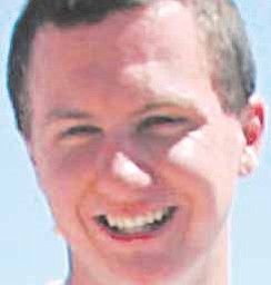 This March 2010 photo shows a man identified as Jared L. Loughner at the 2010 Tucson Festival of Books in Tucson, Ariz. The Arizona Daily Star, a festival sponsor, confirmed from their records that the subject's address matches one under investigation by police after a shooting in Tucson that left U.S. Rep. Gabrielle Giffords wounded and at least five others dead. Police say a suspect is in custody, and he was identified by people familiar with the investigation as Jared Loughner, 22, of Tucson.