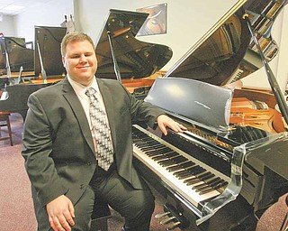 Tom Solich, owner of Solich Piano and Music Co. in Boardman, has been blind all his life and learned to play through a blind tutor.
