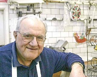 Joe Cherol near the meat counter in his store.
