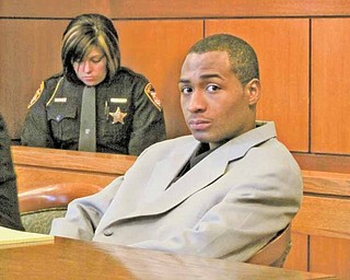 O'Mearo Beaver, right, sits in the courtroom of Judge Peter Kontos of .Trumbull County Common Pleas Court Tuesday Jan. 11 during his trial .on charges of kidnapping and burglary. The trial started Monday with .opening arguments and testimony starting Tuesday.