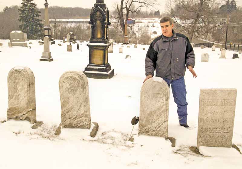 Tim Monroe, road and cemetery superintendent in Liberty Township, stands in Church Hill Cemetery at state Route 304 and Belmont Avenue. Cemetery maintenance is one of the mandated duties of township trustees..