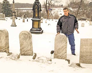 Tim Monroe, road and cemetery superintendent in Liberty Township, stands in Church Hill Cemetery at state Route 304 and Belmont Avenue. Cemetery maintenance is one of the mandated duties of township trustees..