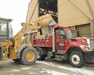 A Liberty Township snow plow at the township garage on Gypsy Lane is filled with salt in anticipation of snowy weather. Maintenance of township roads, including snow and ice removal, is another of a township's mandated duties.