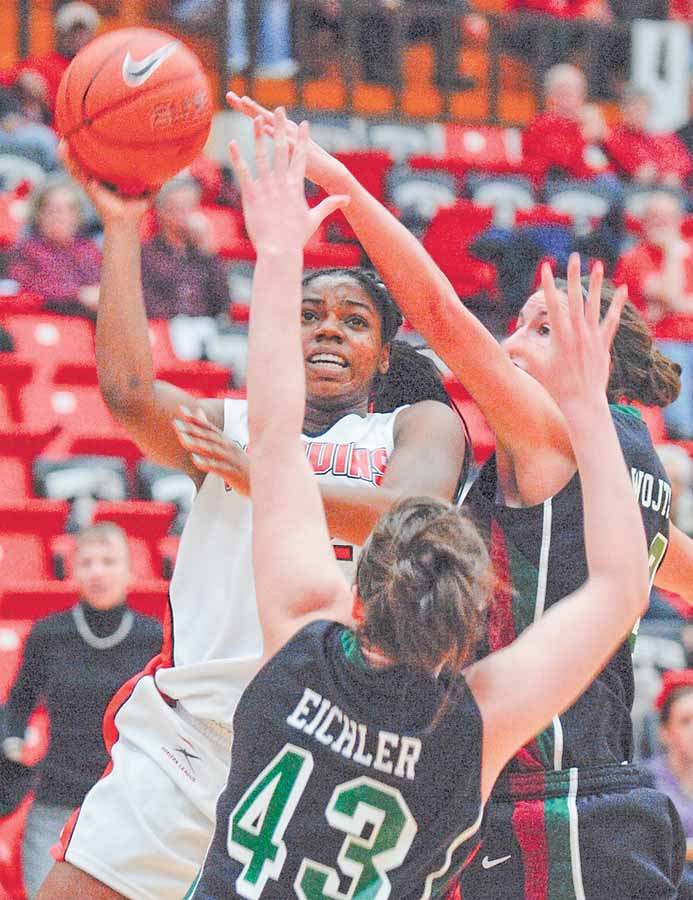 YSU Penguin Brandi Brown shoots and scores while being defended by Green Bay's Sarah Eichler(43) and Julie Wojta (32).