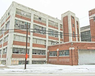 The broken windows of Delphi Packard Electric Plant 8 at Griswold Street and Paige Avenue in Warren. The city has issued a demolition order for this and two other former Delphi plants.