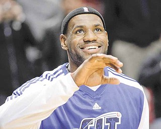Miami Heat's LeBron James warms up before the start of their NBA basketball game with the Portland Trail Blazers Sunday, Jan. 9, 2011, in Portland, Ore.