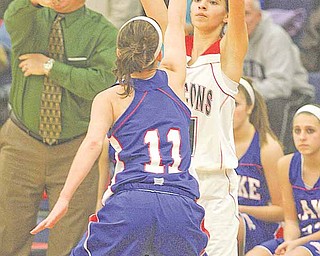 (11) Megan Sefcik of Fitch looks to pass as (11) Miranda Diesz plays defense during their game Thursday night in Austintown.