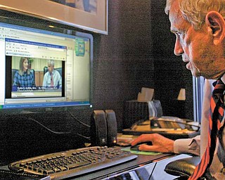 Dr. William H. Lippy, renowned ear doctor from Warren, looks over one of the videos heÕs made that deals with hearing loss and hearing aids. The doctor has five videos available online. The four- to five-minute programs are geared toward the layman and covers a variety of topics on hearing loss and hearing aids. To access the videos, go to www.lippygroup.com and click on hearing-aid videos.