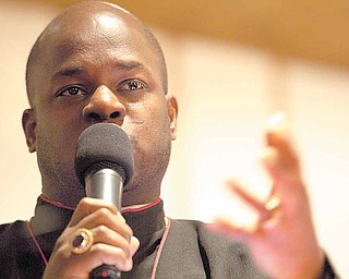 Featured presenter Bishop Durant K. Harvin III, preaches to a packed church about the legacy of Rev. Dr. Martin Dr. Luther King during the Rev. Dr. Martin Luther King Jr. Commemorative Celebration at the Tabernacle Baptist Church in Youngstown.