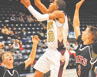 Preston Williams (10) of Liberty shoots and scores while being defended by Jordan Ryan (31) and Jake Jacubec.