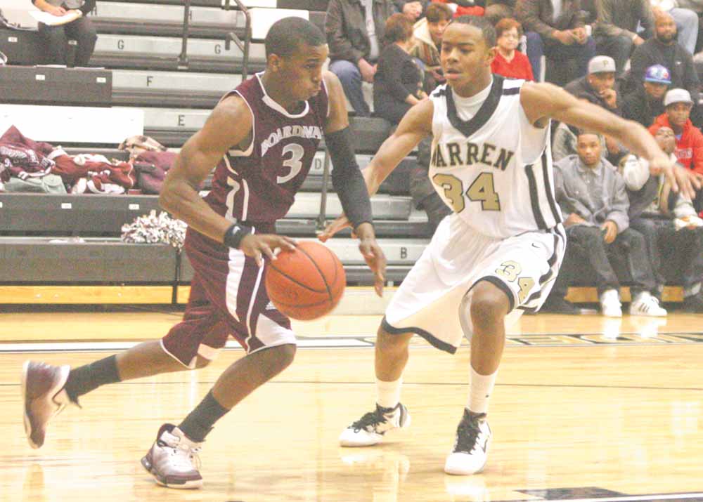 Trae Robinson (3) tries to get past Warren Harding's Tre Brown (34) during their game Tuesday night.