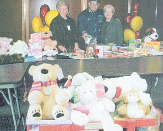 Gifts rolled into hospital: Mill Creek Chapter of the American Business Women’s Association donated toys, which were loaded into a wagon donated by Charles Billock and delivered to children at Akron Children’s Hospital in December by Judy Codespote, Joyce Billock and Kathy Anderson. An engraved plaque was attached to the wagon in memory of Susan Billock, a former member who lost her battle with cancer. Shown as they prepared the gifts for giving were, from left, Sue Heher, hospital volunteer; Charles Billock, Susan’s father, who donated the wagon; and Codespote, chapter president.