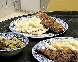 Fried fish, french fries and fried okra are among the menu items at Youngstown Soul Food.