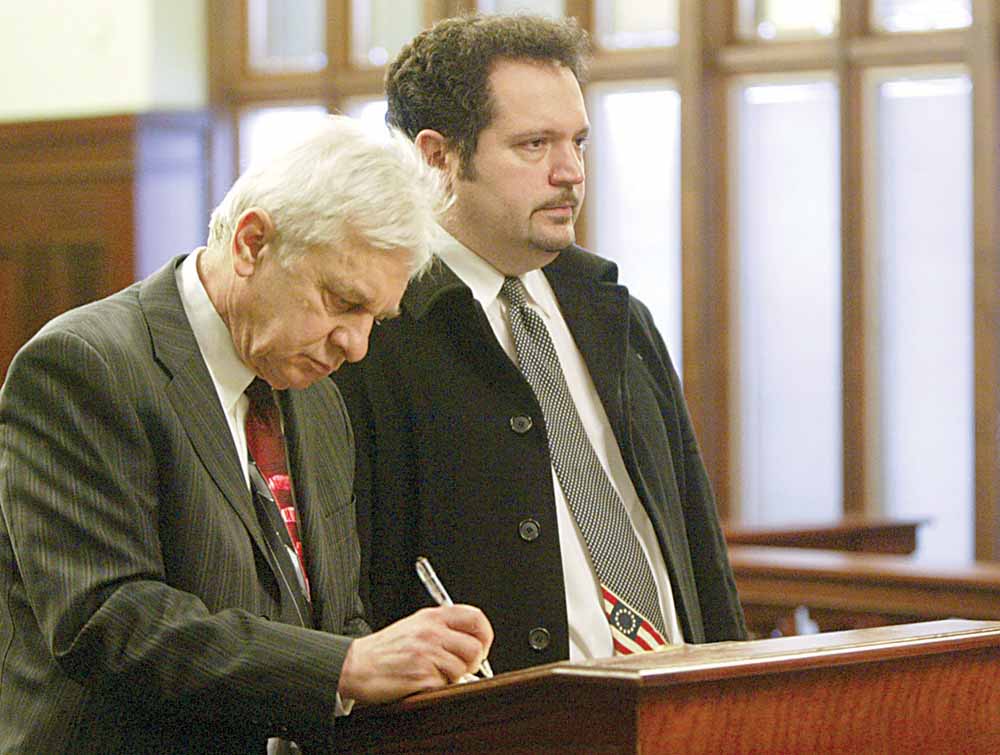 David J. Venerose Jr., 40, of Sheridan Road, right, appears for arraignment on felony charges of passing bad checks and perjury. With him is his lawyer, J. Gerald Ingram. They appeared Wednesday before Magistrate Dominic DeLaurentis of Mahoning County Common Pleas Court.