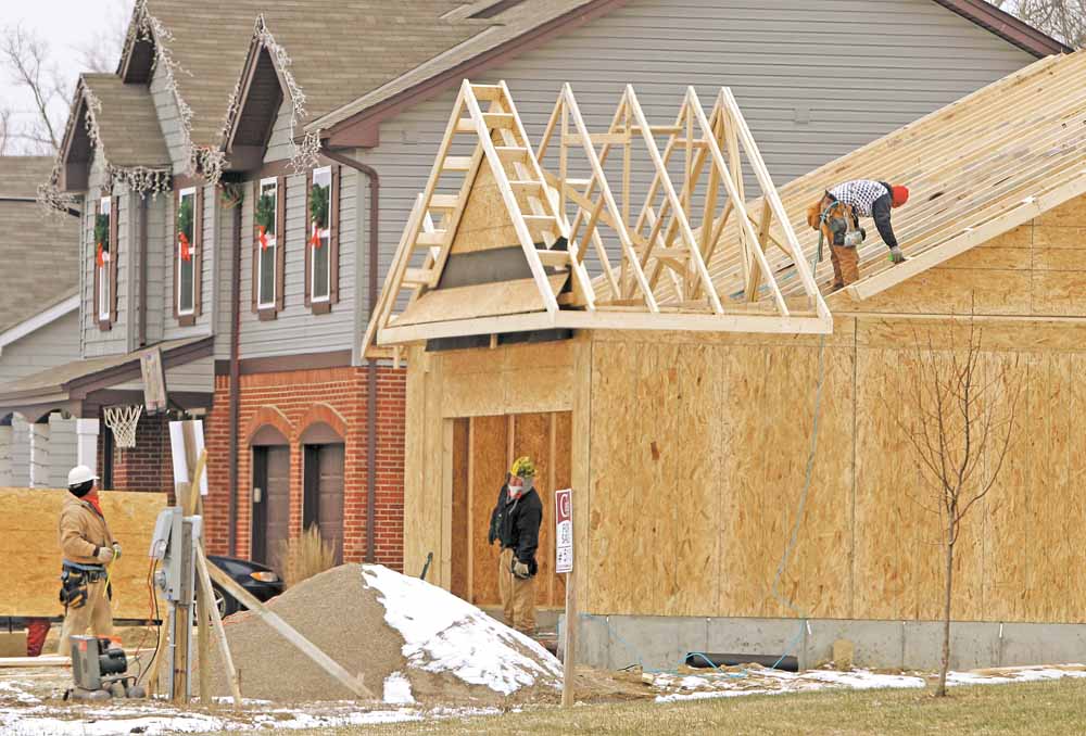 In this Jan. 10, 2011 photo, a new home is under construction, in Monroe, Ohio. U.S. homebuilders remain discouraged over the prospects for improved home sales in the months ahead, unconvinced as yet that the economy will spur the kind of job growth needed to coax more buyers into the market.