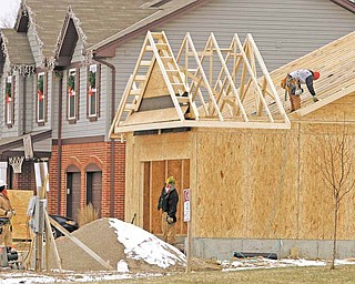 In this Jan. 10, 2011 photo, a new home is under construction, in Monroe, Ohio. U.S. homebuilders remain discouraged over the prospects for improved home sales in the months ahead, unconvinced as yet that the economy will spur the kind of job growth needed to coax more buyers into the market.
