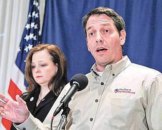 In this Nov. 3, 2010, file photo Tea Party Patriots co-founders Mark Meckler, right, with Jenny Beth Martin, speaks at a news conference at the National Press Club in Washington. Tea party groups say if the government is going to cut spending, the military's budget needs to be part of the mix. "It is time to get serious about preserving the country for our posterity. The mentality that certain programs are 'off the table,' must be taken off the table," Meckler said.