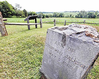In this Aug. 7, 2009 file photo, a gravestone marker on the spot where the arm of General Stonewall Jackson is buried is near the Ellwood house in Locust Grove, Va. Civil War history will play out in a rural Virginia courtroom this week when Wal-Mart Stores Inc. defends a planned store near the hallowed site where Robert E. Lee and Ulysses S. Grant first met on a battlefield in 1864.